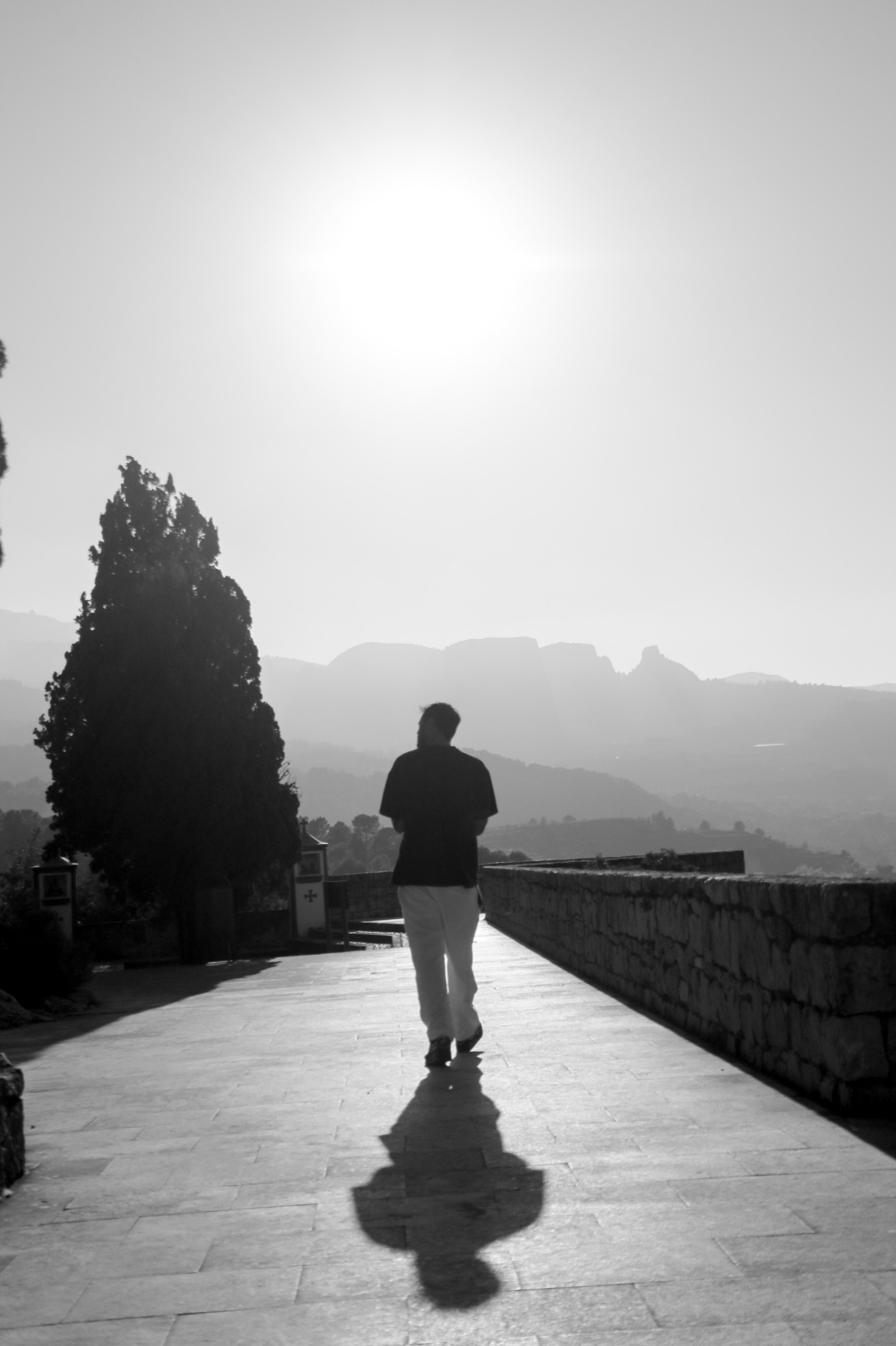 Walking at sunrise in Guadalest, Alicante — black and white