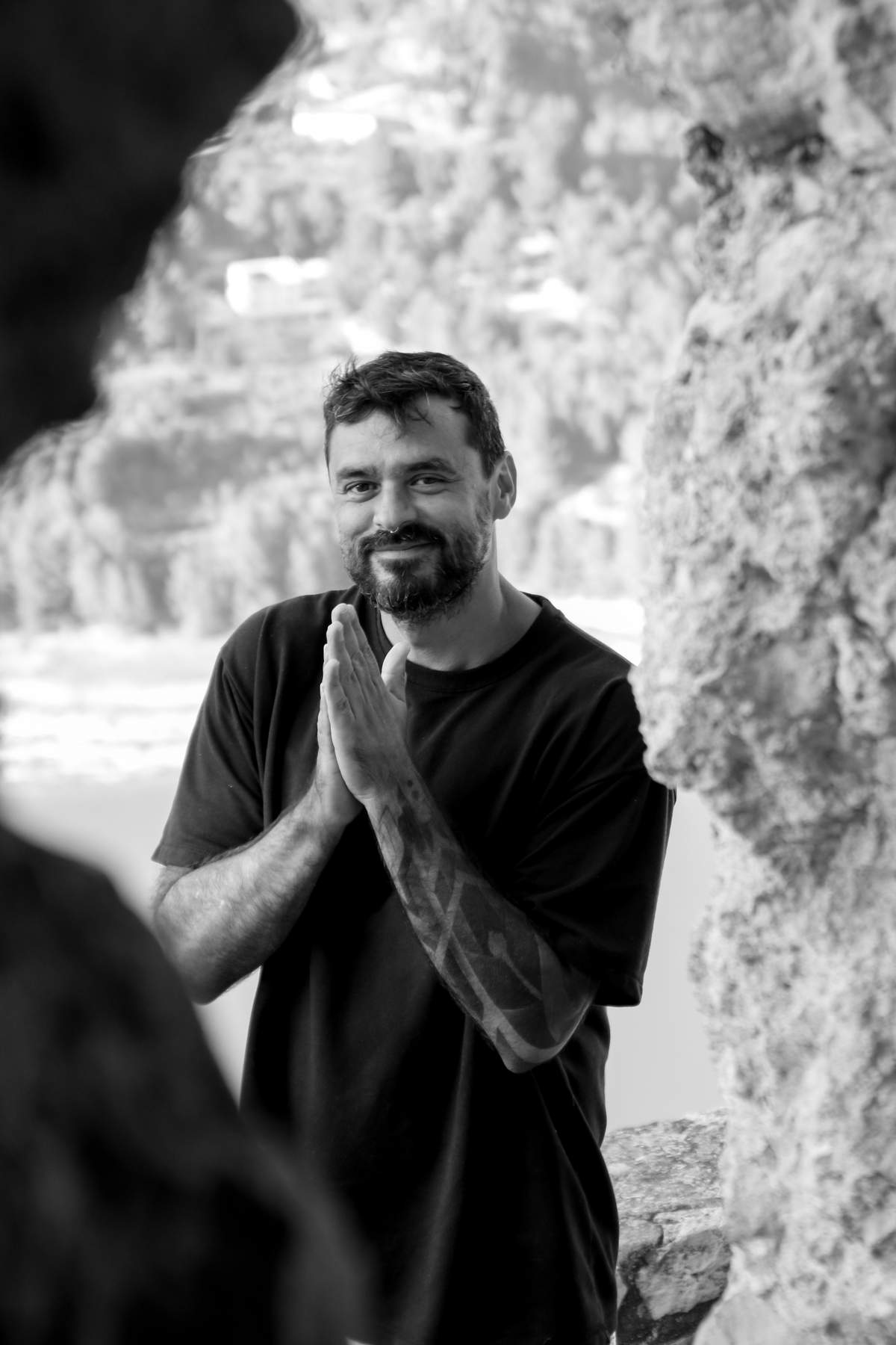 Marcelo Bergés, smiling with hands in prayer